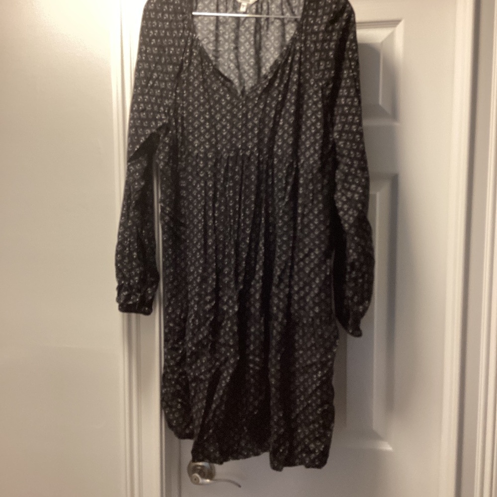 Black dress with white design and tie neck